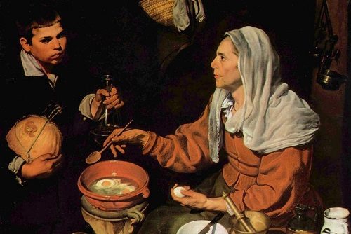 An Old Woman Cooking Eggs