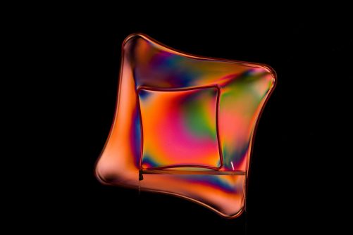 Photoelasticity and Color on a Plastic Plate, photograph by Takis Lazos